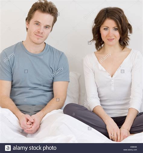 Couple Bed Sitting Man Woman Together Stock Photos And Couple Bed Sitting