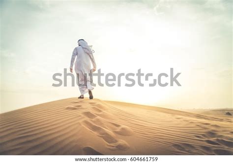 Arabian Man Walking Desert Sunrise Stock Photo 604661759 Shutterstock