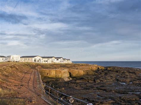 Newbiggin By The Sea S Church Point With Holiday Park At Low Tide