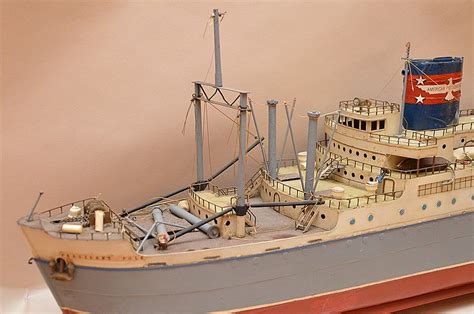Atosscom's objective is to increase the efficiency of ports and harbors through the development and dissemination of information useful to terminal operators, stevedoring, and shipping companies across micronesia. "American President Line", tin ship model, 10"h x 39"w (no c