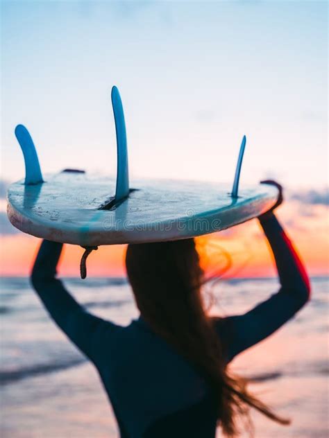 Surf Girl With Long Hair Go To Surfing Woman With Surfboard On A Beach