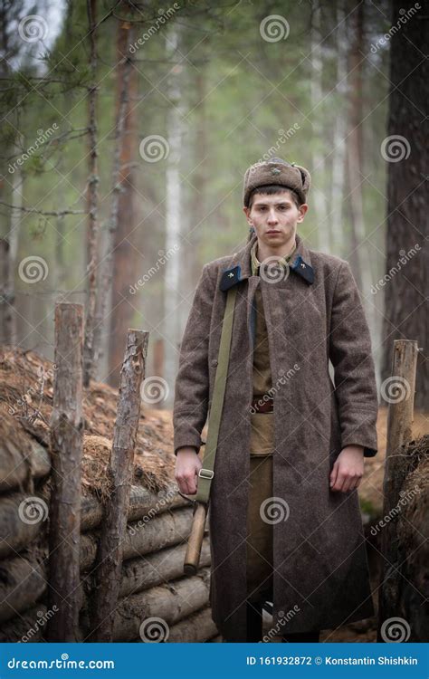 A Soldier Of World War Ii Is Standing In The Trench Stock Photo Image