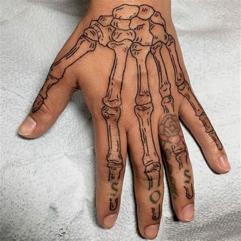 101 Latest Skeleton Hand Tattoos For 2024