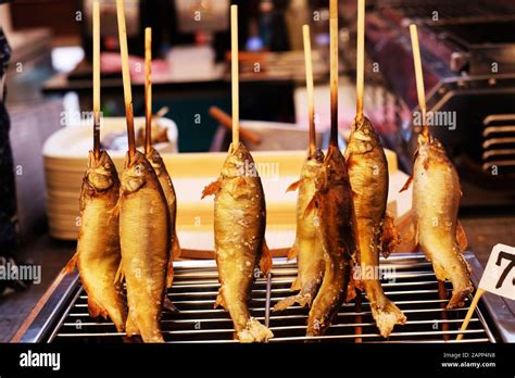 Japanese Grilled Fish In Vertical Line Stock Photo Alamy