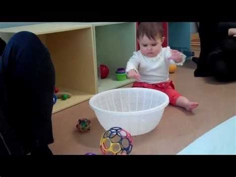 Baby in a RIE Parenting class takes a toy and tries to ...