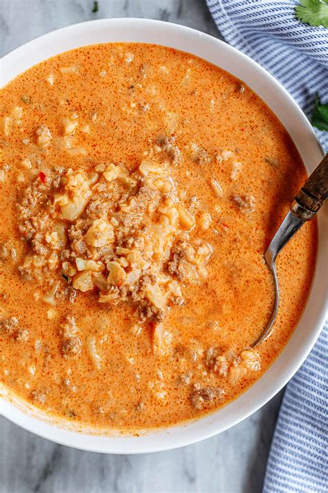 Vegetable oil, for frying, 1 onion, diced, 2 garlic cloves, sliced, 2 sprigs of thyme, plus a few extra leaves to garnish, 1 small cauliflower, 500ml of milk, 200ml of water, or vegetable stock, 150g of cheddar, grated, 20g of parmesan, grated (or a vegetarian alternative). Cauliflower Beef Cream Cheese Soup Recipe — Eatwell101