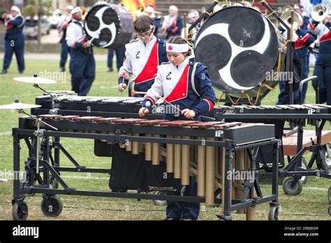 Asian American Teenage Girl Plays The Marimba In A High School Marching