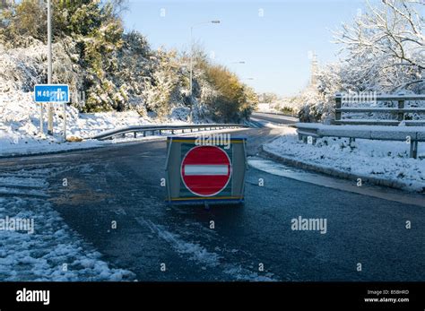 Closed Motorway Slip Road In The Snow Due To An Accident No Entry Sign