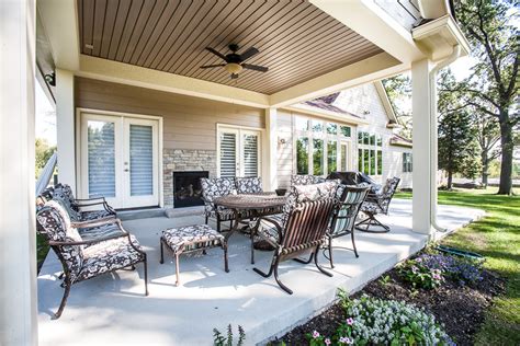 Find life room costs, information and more. Covered Patio Area with fireplace at New Home in ...