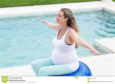 Pregnant Woman Sitting On Exercise Ball Stock Photo Image Of Calm