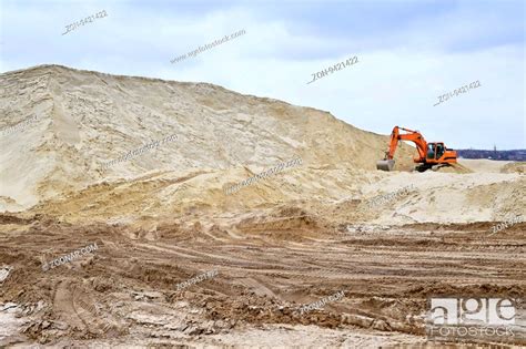 Working Digger In A Quarry Produces Sand Stock Photo Picture And