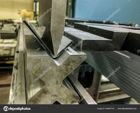 Bending Sheet Metal With A Hydraulic Bending Machine Stock Photo By