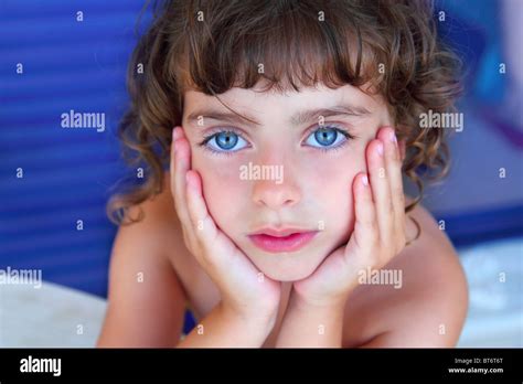 Beautiful Blue Eyes Serene Little Girl Portrait Hands On