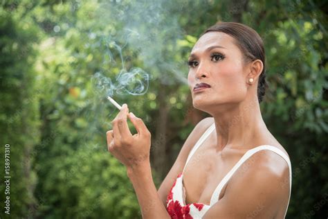 Portrait Of Asian Transwoman Or Transgender Smoking Cigarette In Garden People Smoking And Bad