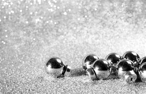 Silver Christmas Balls On Shining Glitter Background Stock Image