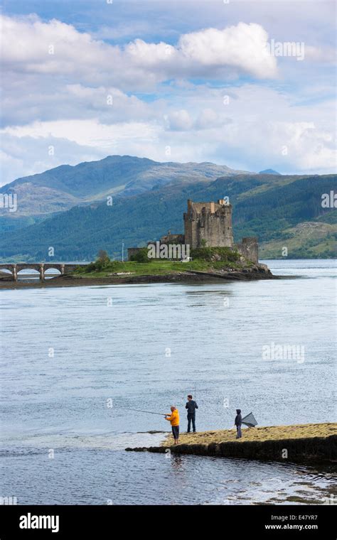 Locals Fishing By Eilean Donan Castle 13th Century Fortress Of Macrae