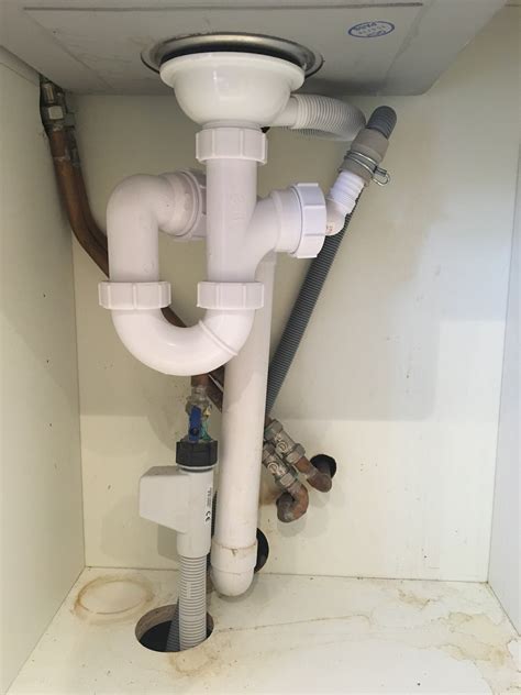 We are having a plumbing problem with the kitchen sink draining. How do I install a drinking water system in cramped ...