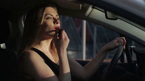 Beautifu Woman Applying Makeup In The Car Stock Video Footage 0011 Sbv