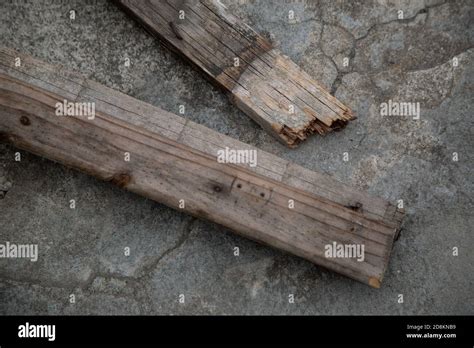 Closeup Of Broken Wood Planks On A Concrete Pavement Stock Photo Alamy