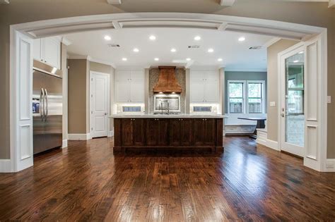 A range hood or kitchen hood is a device containing a blower that hangs above the stove or induction cooktop in the kitchen. Kitchen with Copper Hood - Transitional - Kitchen