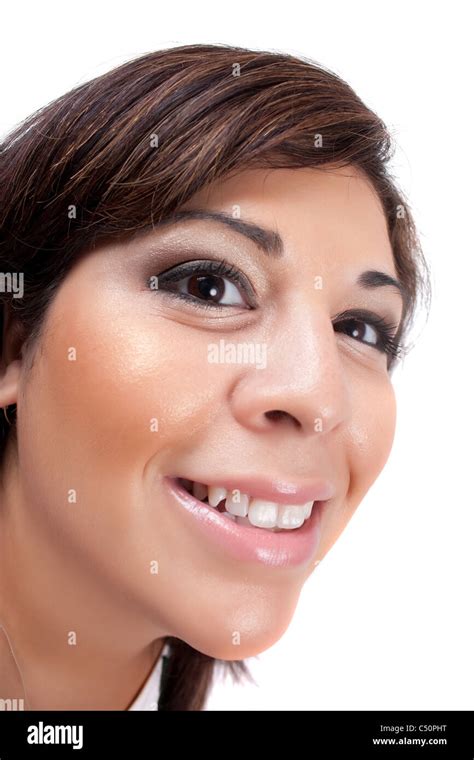 Woman With A Happy Look On Her Face Smiles Over A White Background