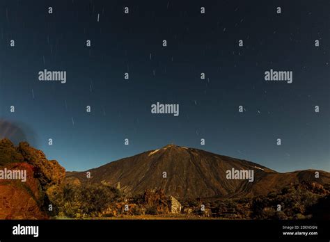 Mount Teide Lit By The Full Moon And Star Trails At Night In The Las