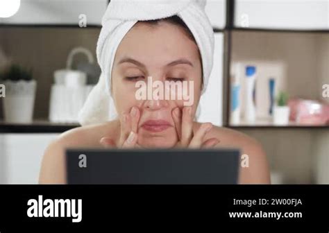 Facial Skin Massage Attractive Girl In Bathroom With Towel And Mirror Does Facial Massage In