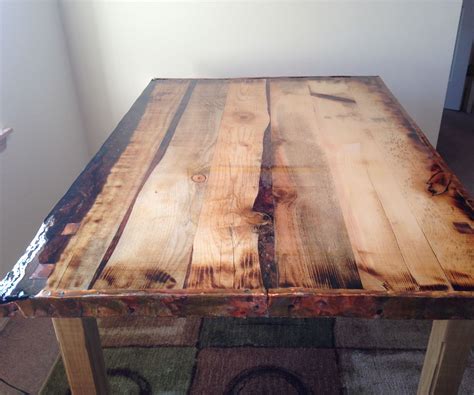 Any epoxy drips on the under side of the table can be cut off within a few hours and then sanded down evenly after the top is fully cured. Epoxy Finished, Rustic Dining Table : 4 Steps - Instructables