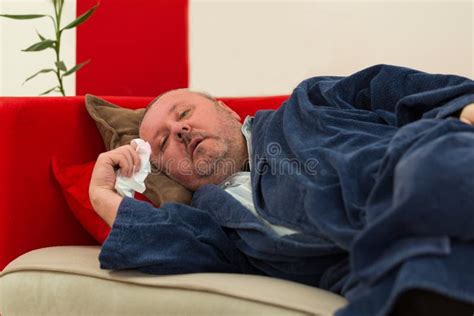 Sick Man Lying Down On Couch With High Fever Stock Image Image Of