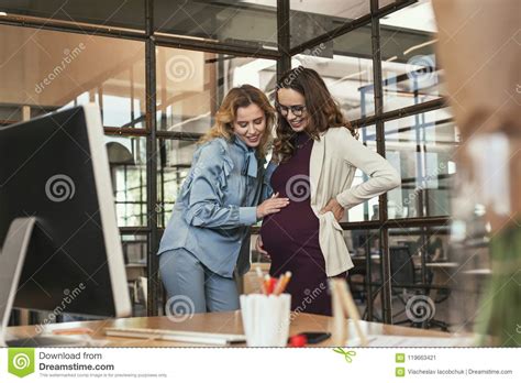 Optimistic Colleague Heartening Pregnant Woman Stock Image - Image of ...