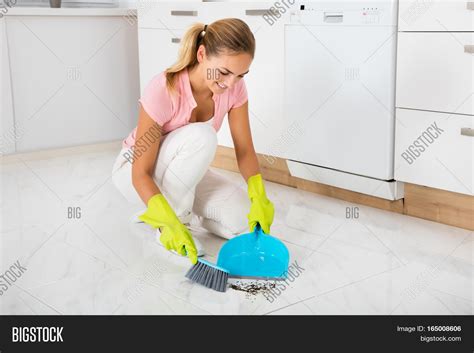 smiling woman sweeping image and photo free trial bigstock