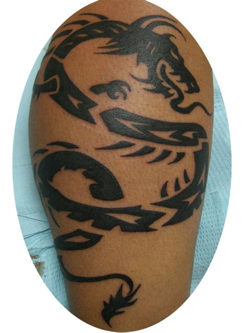 Many crazy tattoo enthusiasts opt for the dragon tattoo sleeve. Arm Dragon-Style Tribal Tattoo Design