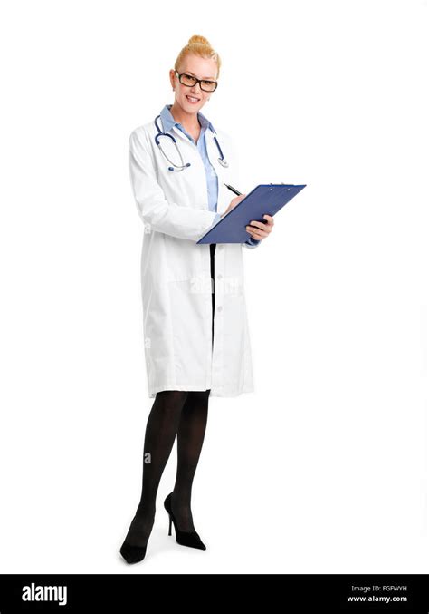 Full Length Portrait Of Female Doctor Standing Agains White Background