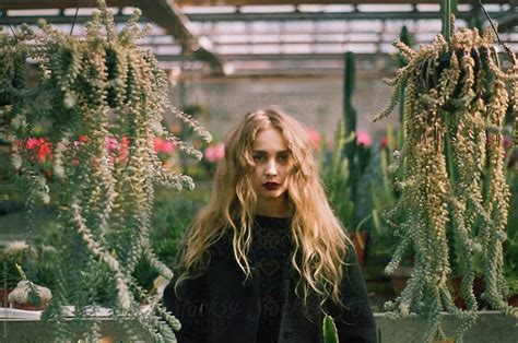 A Fearless Woman In A Greenhouse By Stocksy Contributor Anna Malgina Stocksy