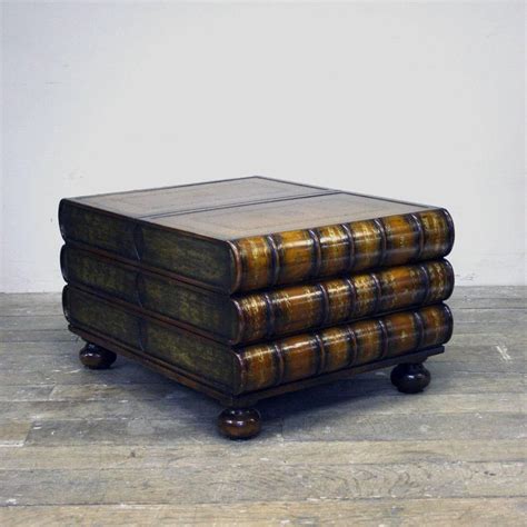 Whimsical table in the form of three large leather bound books with gilt trim. Maitland-Smith Stacked Book Coffee Table at 1stdibs