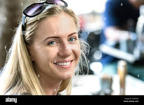 Portrait Of A Poland Young Woman 24 Years Looking Camera With Sunglasses On Forehead Smiling