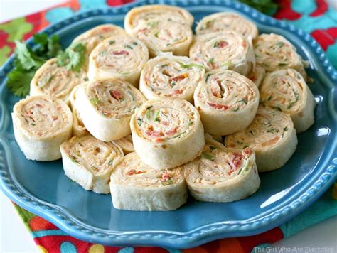 These crescent chicken roll ups are truly a favorite family recipe. Chicken Enchilada Roll Ups - The Girl Who Ate Everything