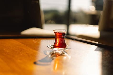 Turkish Tea Served In Tulip Shaped Glass On Rustic Table Turkish Tea