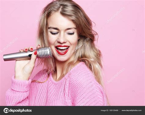 Happy Singing Girl Beauty Woman Wearing Pink Pullover With Mic Stock