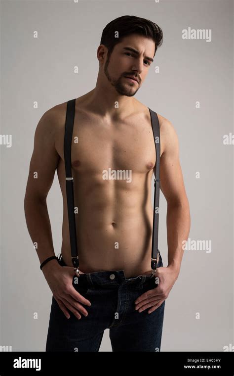 Shirtless Man Wearing Jeans And Suspenders Stock Photo Alamy