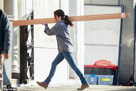 Sandra Bullock Shows Some Strength As She Carries Lumber Across The Set