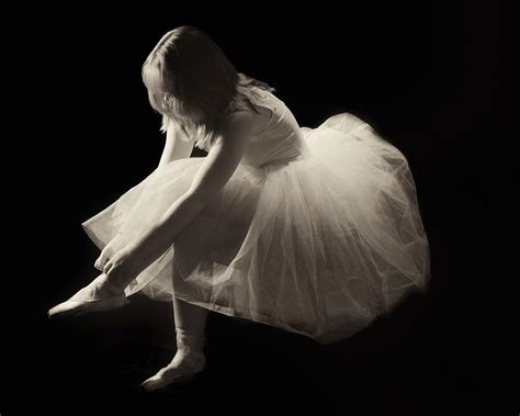 Black And White Of A Ballet Dancer Tying Her Shoe Photograph By