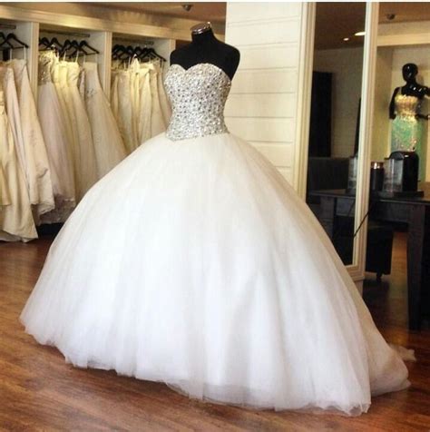 If you don't wish to cover up that much, you can get a ball dress with a strapless neckline and corset back style. 2015 Luxury Crystal Ball Gowns Sparkly Rhinestone Beaded ...
