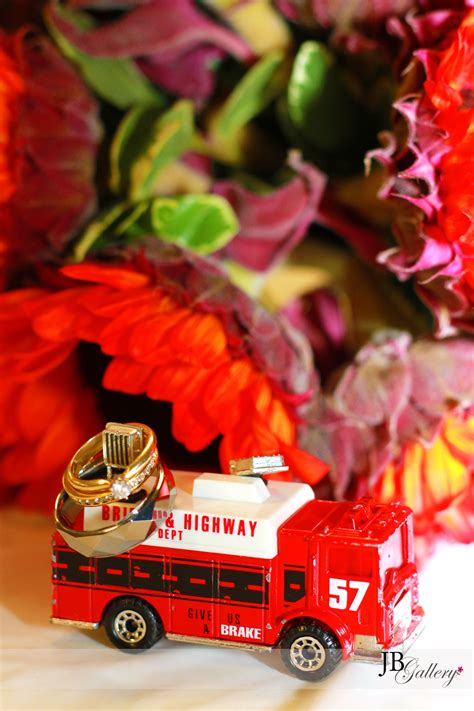 New unity wedding idea, the beautiful unity cross assembled by the bride and groom. Wedding flower bouquet, rings, and firetruck | Firefighter ...
