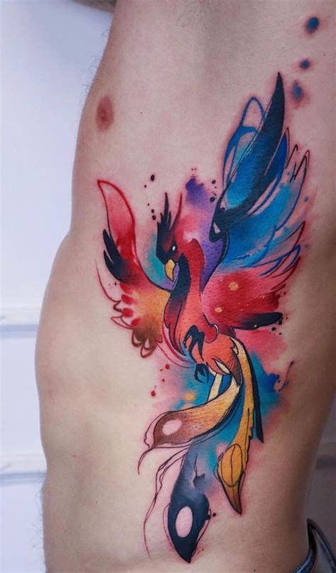 A Colorful Bird Tattoo On The Side Of A Mans Stomach