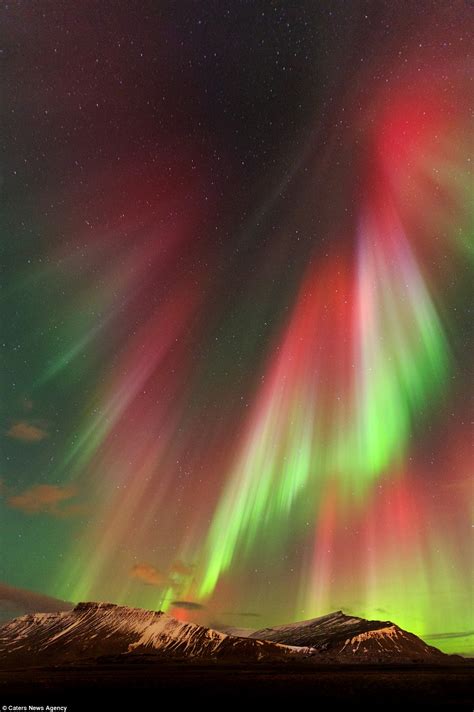 Image Of Christ The Redeemer Appears In Aurora Borealis Above Iceland