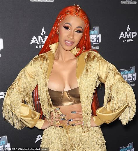 cardi b flaunts cleavage in gold ensemble as she performs hot sex picture