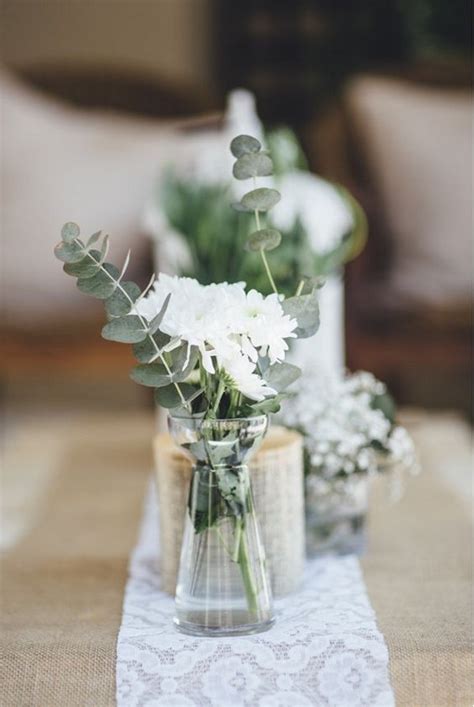 A simple white knot creates the perfect addition to a centerpiece for a hint. 18 Chic Rustic Wedding Centerpieces with Tree Stumps ...