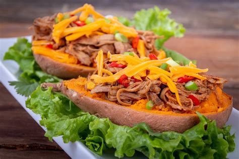 Delicious Spicy Pulled Pork Stuffed Sweet Potato Dish Stock Image