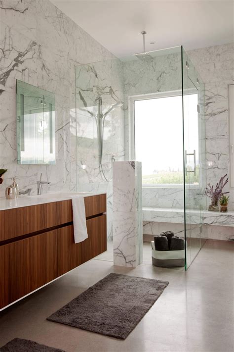This backdrop has intricate detailing with 'om' etched on it. Beautiful Marble Shower Designs And The Decors That ...